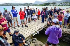 Purple Maiʻa helping at the fish pond